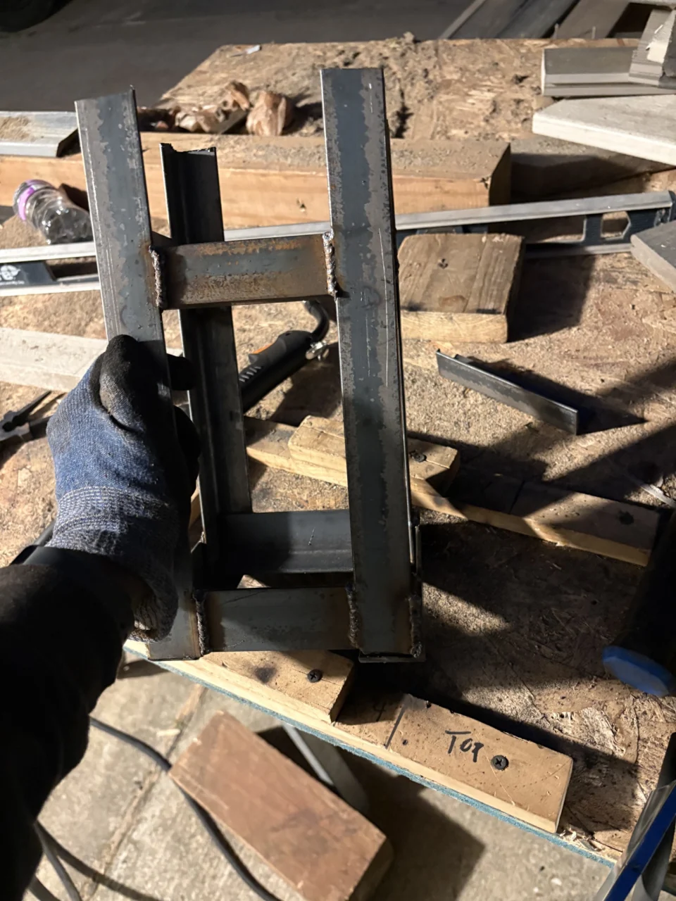 Owner-supplied photo from the ten-bracket fence-post project before cleanup; work in progress, not a finished result